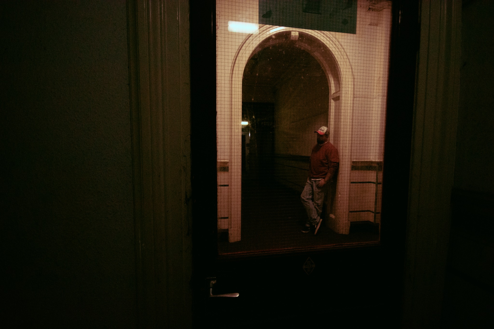 Morning Colour sitting alone in a dark corridor